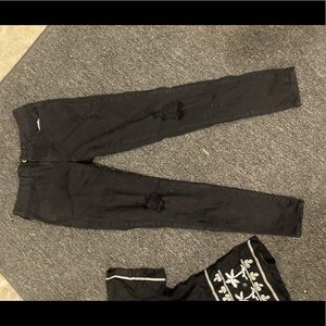 Womens ripped black skinny mid rise jeans